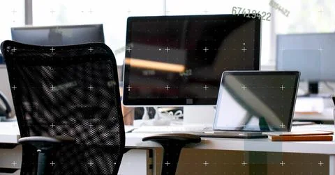 Vertical image: Shifting camera showing monitor and laptop at desk revealing Stock Photos