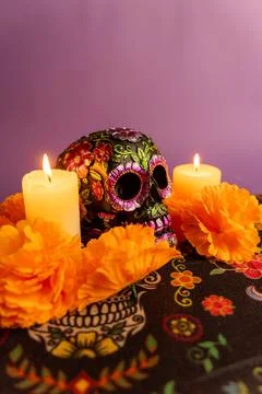 A vertical image showcasing a decorated skull with metallic flowers, flanke.. Stock Photos