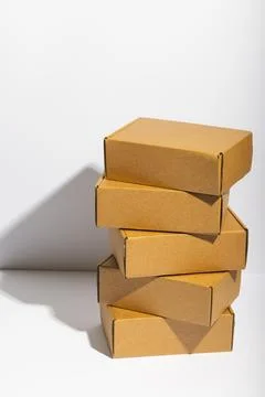 Vertical image of stack of cardboard gift boxes with copy space over white 스톡 사진