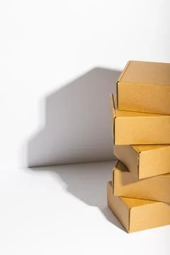 Vertical image of stack of cardboard gift boxes with copy space over white 스톡 사진
