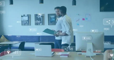 Vertical image: Two men reviewing green folder walking in biz planning, she Stockfoto's