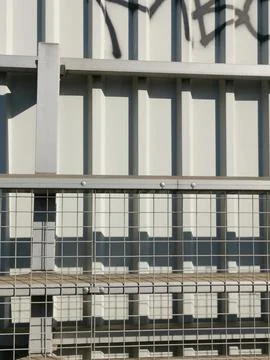 Vertical image of various types of grey metal netting and fencing Stock Photos