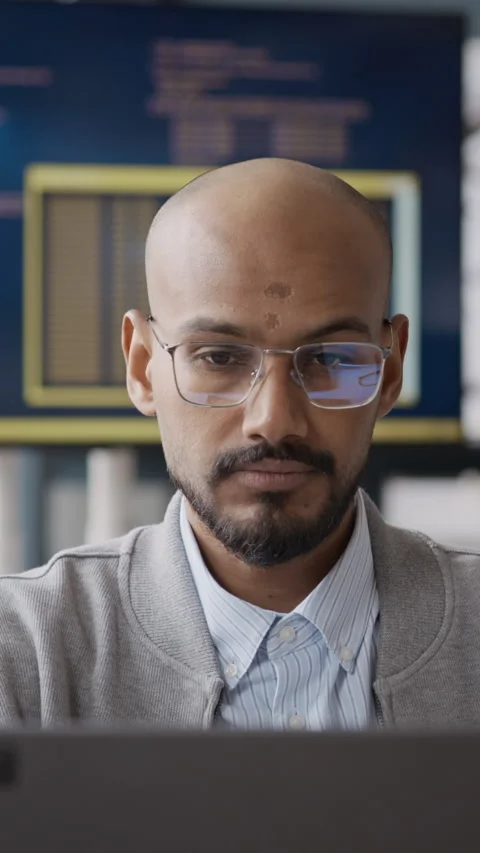Vertical of Indian Male Programmer with Glasses Working on Laptop in IT Office Video stock 337485506