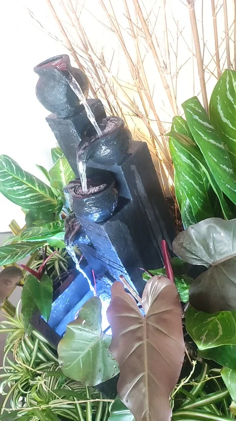Vertical Indoor Mini Waterfall with Tropical Plants Video stock 329316239