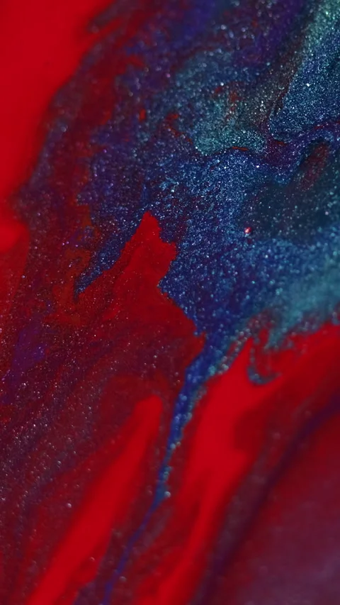 Vertical Ink drip glitter fluid flow red blue paint blend Stock Footage 278176154