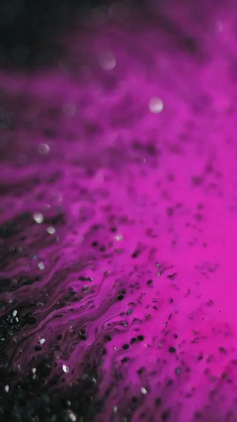 Vertical Ink drop paint splatter pink blotch glitter black Video stock 276788884