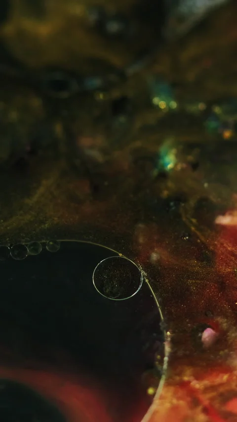 Vertical ink splash glitter fluid oil bubbles Stock Footage 285336803