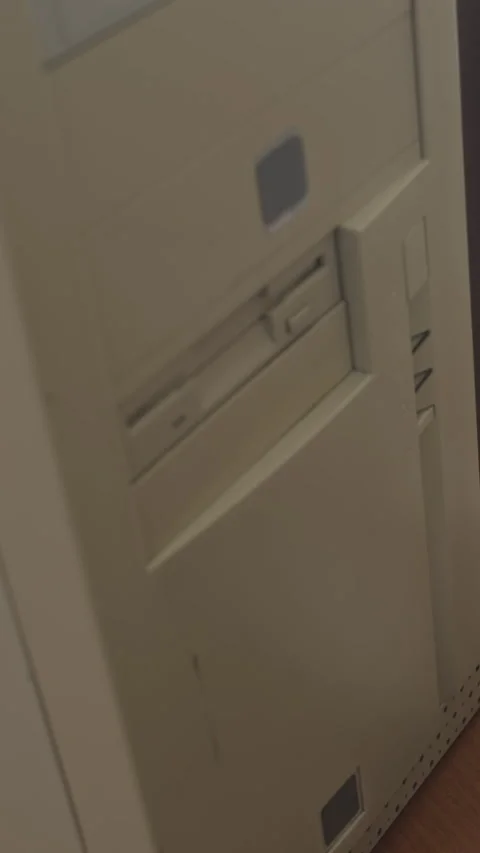 Vertical of Inserting Floppy Disk into Computer Stock Footage 285172218