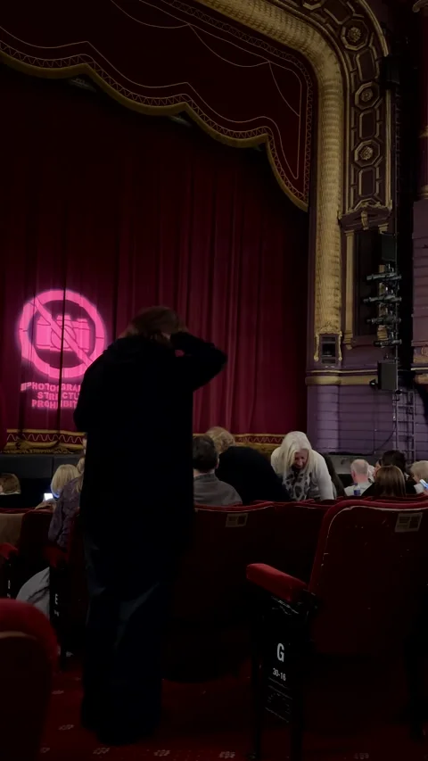 Vertical. Inside of English theatre before performance, people, stage. Видео 298994538