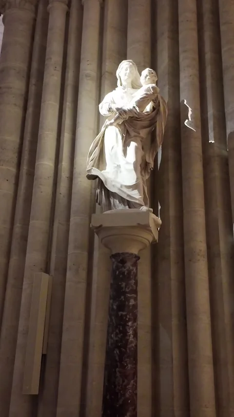 Vertical interior view about one of the Notre Dame ancient statues in gothic Stock Footage 302564499