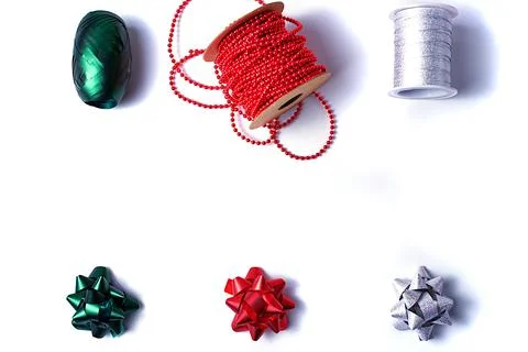 Vertical isolate of ribbons and bows in three colors - green, white and red.  Stock Photos