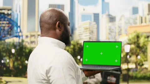 Vertical isolated green screen on mobile phone held by businessman Stock Footage 343500480