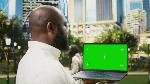 Vertical isolated green screen on mobile phone held by businessman Stock Footage 343506706
