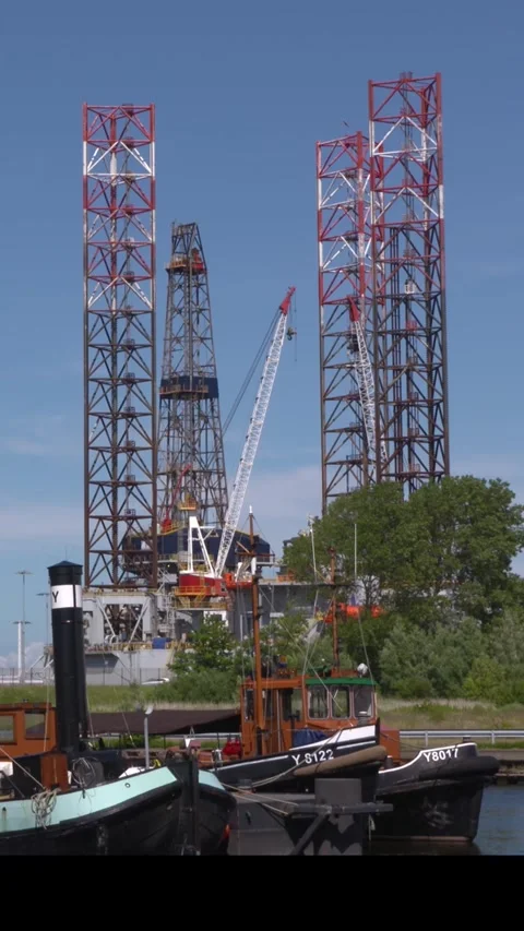 Vertical - Jackup Paragon c462 towering above Naval Dockyard Willemsoord Stock Footage 306955673