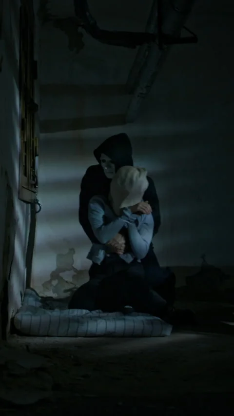 Vertical of Kidnapper Dragging Hostage into Abandoned Basement Vidéo 294700670