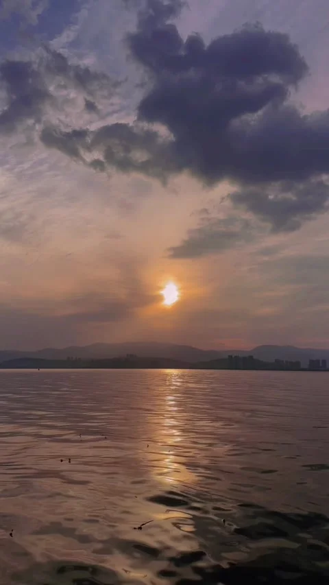 Vertical Kunming Dian Lake sunset city skyline reflections Stock Footage 333552902