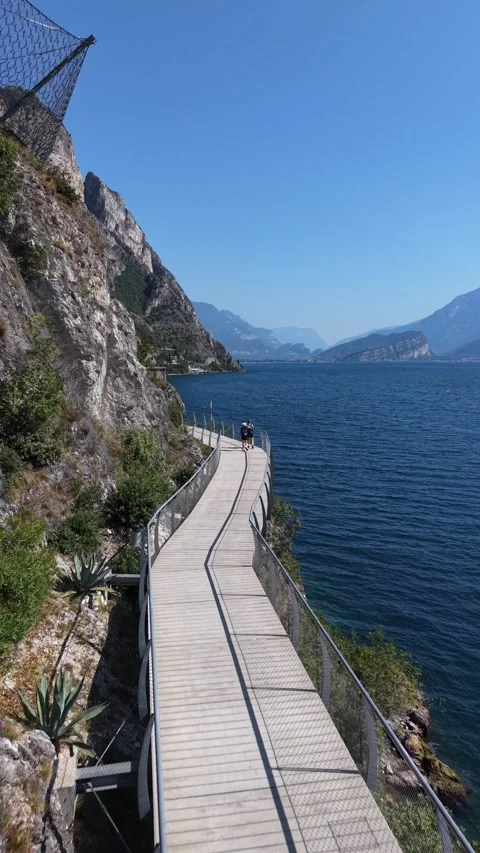Vertical Lake Garda Suspended Cycle Path at Limone sul Garda Italy 動画素材 341477545
