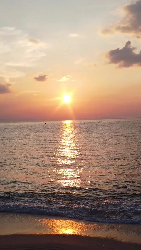 Vertical landscape of colorful gradient sunset above ocean waves beach afternoon Stock Footage 325833986