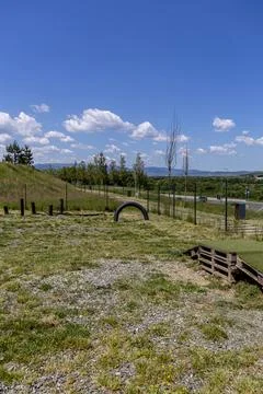 Vertical Landscape of Empty Public Park Field Under Blue Sky Stock-Fotos