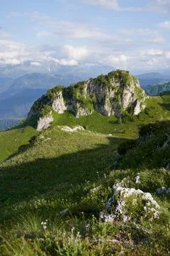 Vertical landscape with isolated rock among a mountain pass. Stock Photos