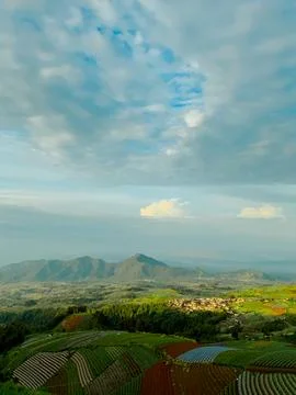 Vertical landscape view of terraced mountain farms at sunrise Stock-Fotos