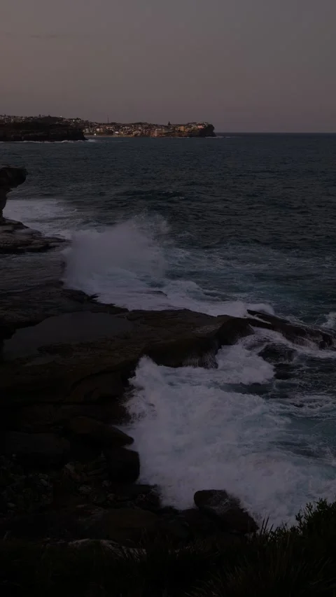 Vertical large splash from a wave against rock floor in Sydney near Bondi Stock Footage 306820588
