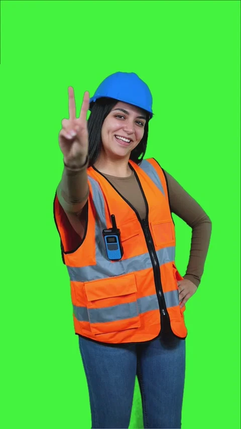 Vertical Latin construction worker woman counting on chroma key Stock Footage 308743383