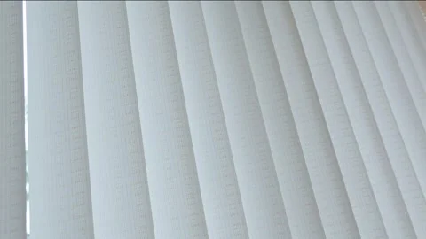 Vertical light blinds, curtains made of thick fabric, protect against light.. Stock Footage 255273653