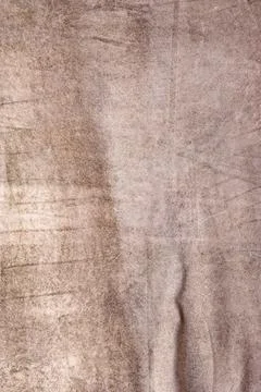 Vertical light brown suede background. Suede beige leather in a fold. Stock Photos