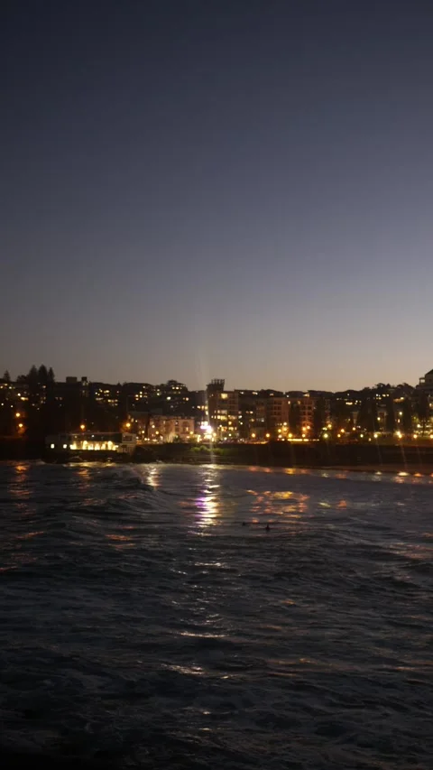 Vertical light patterns on the sea in the evening at Coogee Sydney 6K Video stock 305891122