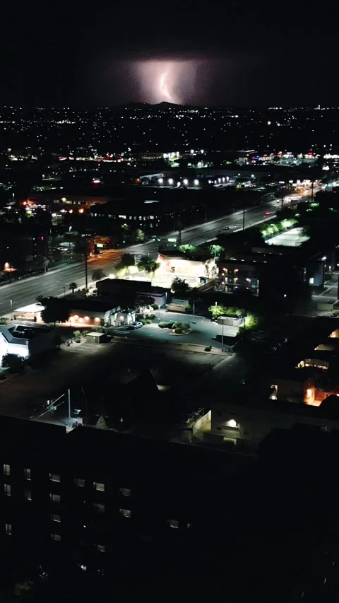 VERTICAL LIGHTNING STRIKE OVER STREET NIGHT CITY Stock Footage 248575837