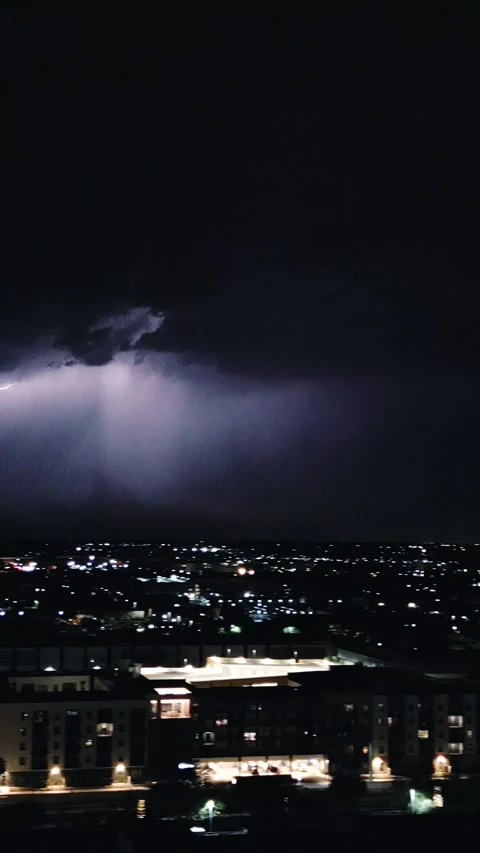 VERTICAL LIGHTNING STRIKE OVER TOWN Video stock 248578718