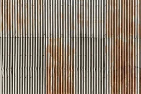 Vertical line pattern of wave zinc wall rusty texture Stock Photos