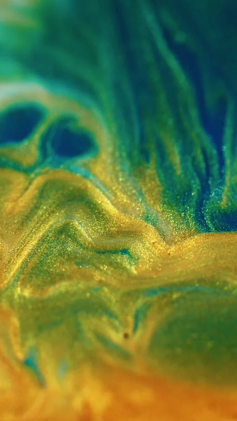 Vertical liquid glitter spill paint golden blue Video stock 287530877
