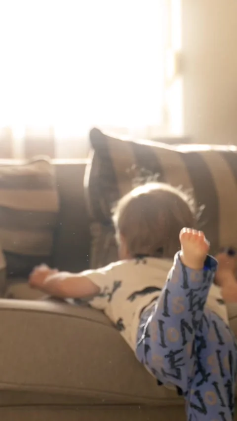 Vertical of Little Boy Laying on Couch Stock Footage 274145363