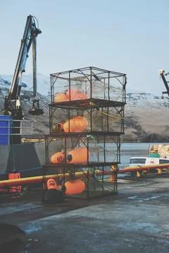 Vertical of loading crab cages on the dock outdoors Stock Photos