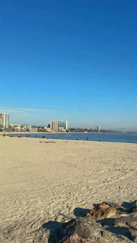 Vertical Long Beach Sandy Beach Calm Ocean and Coastal Towers 스톡 동영상 346186870