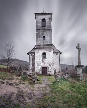 Vertical long exposure shot of old Church of Saint John of Nepomuk falling apart Stock Photos
