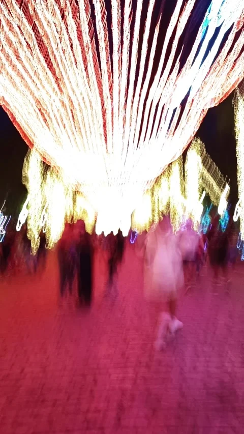 Vertical long exposure time lapse from People in front of christmas lights on pr Vídeos de archivo 297283192