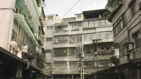 Vertical look up pane view of old residential neighborhood narrow alley of muddy Stock Footage 236289371