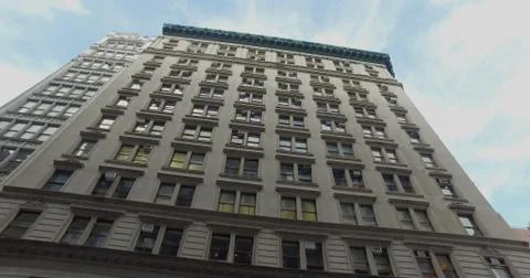 Vertical look up view of typical NYC style apartment office building day Stock Photos