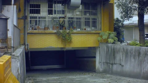 Vertical looking up view from a dirty old cement paved underground garage  Stock Footage 204483931