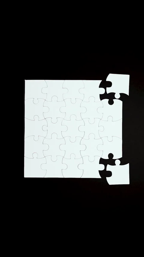 Vertical looped stop motion video of white blank puzzle pieces assembling Stock Footage 316084563