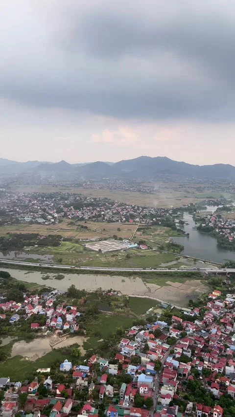 (Vertical) Low Altitude Aerial View of a Riverside Village Video stock 342590778