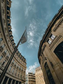 Vertical low angle of beautiful old buildings in Paris Stock Photos