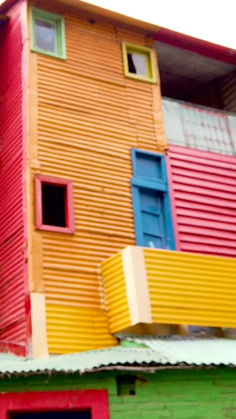 Vertical Low Angle of Colorful Corrugated Houses in Caminito La Boca Buenos 動画素材 348954222