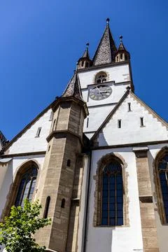 Vertical Low Angle of Majestic Gothic Church Cathedral Tower Stock Photos