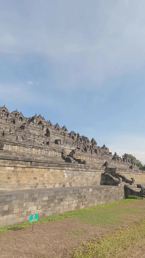 Vertical Low Angle Panning Shot of Borobudur Temple Java Indonesia Stock Footage 338160565