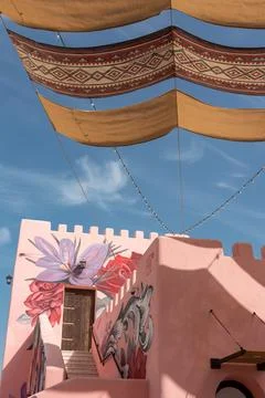 Vertical Low Angle of Pink Building with Arabic Canopy at Mina District. Stock Photos