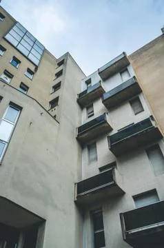 A vertical low angle shot of a brown abstract architectural building with bal Foto stock